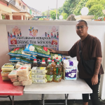Rice donation ritual for merit making at Thai temple
