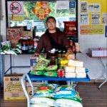 Rice donation ritual for merit making at Thai temple