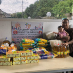 Rice donation ritual for merit making at Thai temple